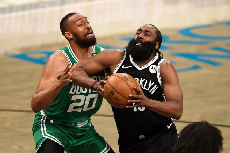 May 22, 2021; Brooklyn, New York, USA;  Brooklyn Nets guard James Harden (13) drives to the basket on Boston Celtics forward Jabari Parker (20) lduring the third quarter of game one in the first round of the 2021 NBA Playoffs. at Barclays Center. Mandatory Credit: Dennis Schneidler-USA TODAY Sports