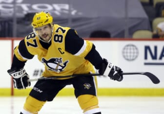 May 24, 2021; Pittsburgh, Pennsylvania, USA;  Pittsburgh Penguins center Sidney Crosby (87) prepares to take the opening tac-off of the first overtime period against the New York Islanders in game five of the first round of the 2021 Stanley Cup Playoffs at PPG Paints Arena. New York won 3-2 in double overtime. Mandatory Credit: Charles LeClaire-USA TODAY Sports