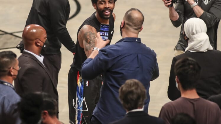 Jun 7, 2021; Brooklyn, New York, USA; Brooklyn Nets guard Kyrie Irving (11) interacts with the fans after the Nets defeated the Milwaukee Bucks 125-86 in game two in the second round of the 2021 NBA Playoffs. at Barclays Center. Mandatory Credit: Wendell Cruz-USA TODAY Sports