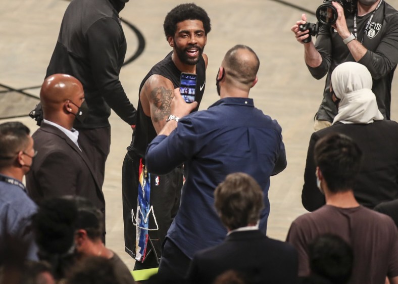 Jun 7, 2021; Brooklyn, New York, USA; Brooklyn Nets guard Kyrie Irving (11) interacts with the fans after the Nets defeated the Milwaukee Bucks 125-86 in game two in the second round of the 2021 NBA Playoffs. at Barclays Center. Mandatory Credit: Wendell Cruz-USA TODAY Sports