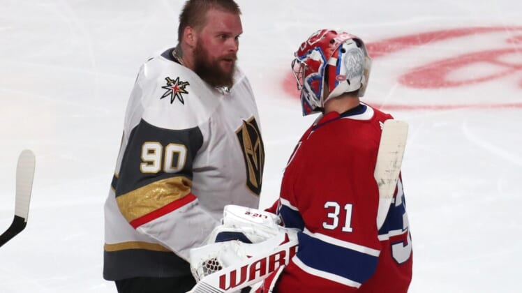 Jun 24, 2021; Montreal, Quebec, CAN; Montreal Canadiens goaltender Carey Price (31) and Vegas Golden Knights goaltender Robin Lehner (90) congratulate each other during an overtime period in game six of the 2021 Stanley Cup Semifinals at Bell Centre. Mandatory Credit: Jean-Yves Ahern-USA TODAY Sports