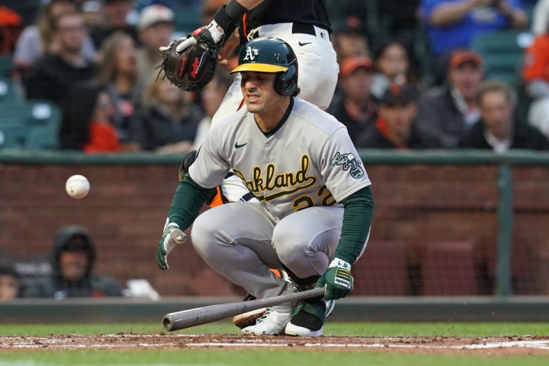 Jun 26, 2021; San Francisco, California, USA; Oakland Athletics center fielder Ramon Laureano (22) reacts after being hit by a pitch against the San Francisco Giants in the third inning at Oracle Park. Mandatory Credit: Cary Edmondson-USA TODAY Sports
