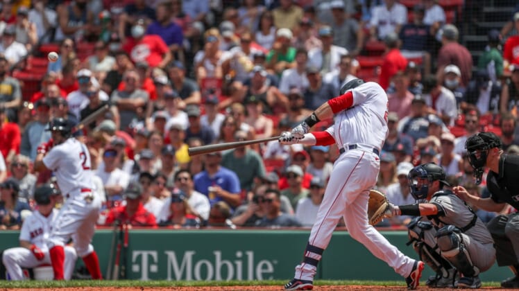 Jun 27, 2021; Boston, Massachusetts, USA; Boston Red Sox designated hitter JD Martinez (28) hits a home run during the third inning against the New York Yankees at Fenway Park. Mandatory Credit: Paul Rutherford-USA TODAY Sports