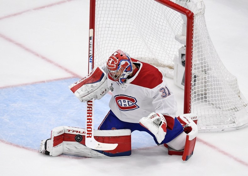 Jul 7, 2021; Tampa, Florida, USA; Montreal Canadiens goaltender Carey Price (31) makes a save against the Tampa Bay Lightning during the first period in game five of the 2021 Stanley Cup Final at Amalie Arena. Mandatory Credit: Douglas DeFelice-USA TODAY Sports