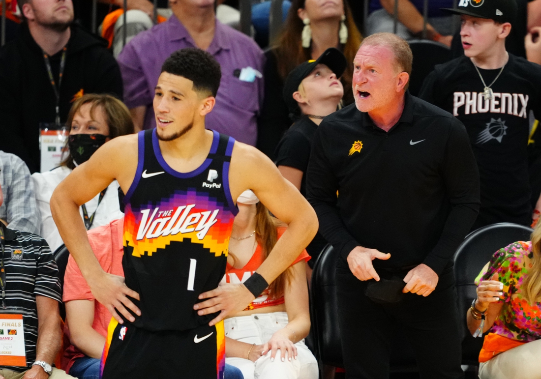 Jul 8, 2021; Phoenix, Arizona, USA; Phoenix Suns owner Robert Sarver reacts alongside guard Devin Booker (1) against the Milwaukee Bucks in game two of the 2021 NBA Finals at Phoenix Suns Arena. Mandatory Credit: Mark J. Rebilas-USA TODAY Sports