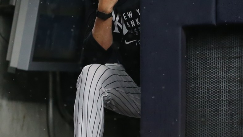 Jul 17, 2021; Bronx, New York, USA; New York Yankees manager Aaron Boone (19) watches during the sixth inning against the Boston Red Sox at Yankee Stadium. Mandatory Credit: Brad Penner-USA TODAY Sports