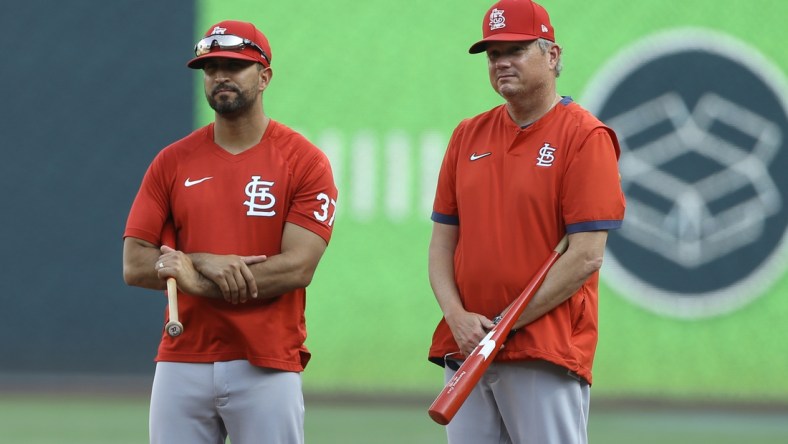 Aug 27, 2021; Pittsburgh, Pennsylvania, USA;  St. Louis Cardinals bench coach Oliver Marmol (37) and manager Mike Shildt (right) observe batting practice before the game against the Pittsburgh Pirates at PNC Park. Mandatory Credit: Charles LeClaire-USA TODAY Sports