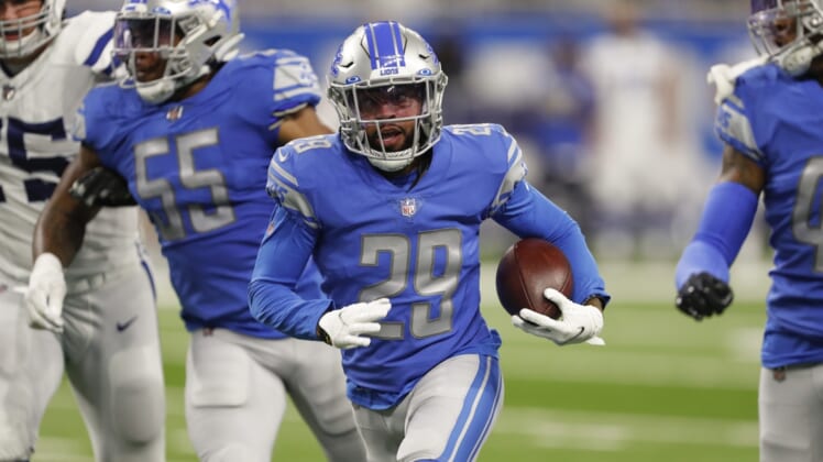 Aug 27, 2021; Detroit, Michigan, USA; Detroit Lions cornerback Corn Elder (29) runs the ball after an interception during the third quarter against the Indianapolis Colts at Ford Field. He was later ruled down by contact at the spot of the interception. Mandatory Credit: Raj Mehta-USA TODAY Sports