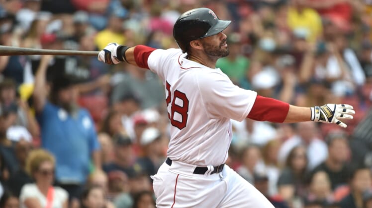 Sep 5, 2021; Boston, Massachusetts, USA; Boston Red Sox designated hitter J.D. Martinez (28) hits a two run home run during the sixth inning against the Cleveland Indians at Fenway Park. Mandatory Credit: Bob DeChiara-USA TODAY Sports