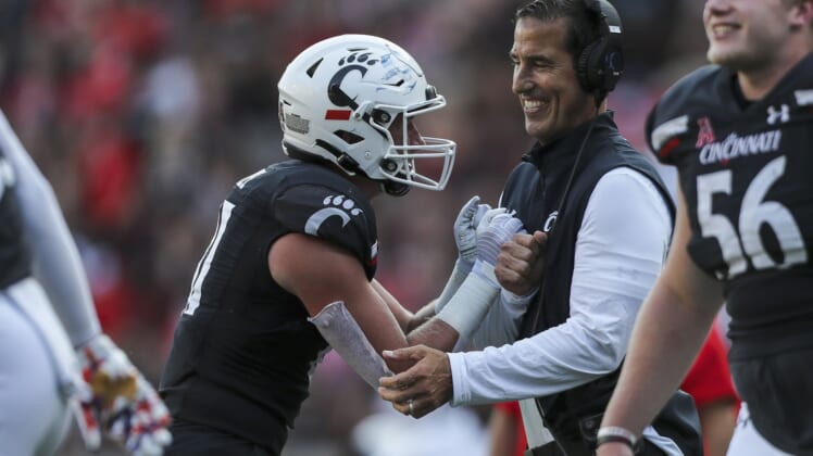 Sep 11, 2021; Cincinnati, Ohio, USA; Cincinnati Bearcats tight end Josh Whyle (81) celebrates after a touchdown with head coach Luke Fickell in the second half against the Murray State Racers at Nippert Stadium. Mandatory Credit: Katie Stratman-USA TODAY Sports
