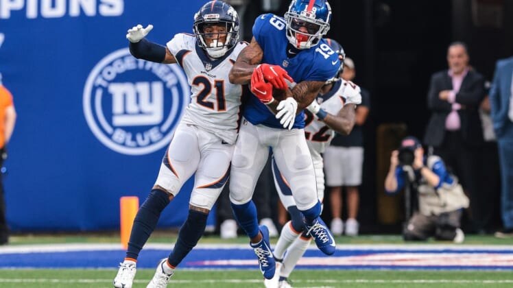 Sep 12, 2021; East Rutherford, New Jersey, USA; New York Giants wide receiver Kenny Golladay (19) catches the ball over Denver Broncos cornerback Ronald Darby (21) during the second half at MetLife Stadium. Mandatory Credit: Vincent Carchietta-USA TODAY Sports