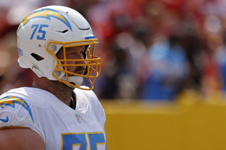 Sep 12, 2021; Landover, Maryland, USA; Los Angeles Chargers offensive tackle Bryan Bulaga (75) stands on the field during warmups prior to the Chargers' game against the Washington Football Team at FedExField. Mandatory Credit: Geoff Burke-USA TODAY Sports