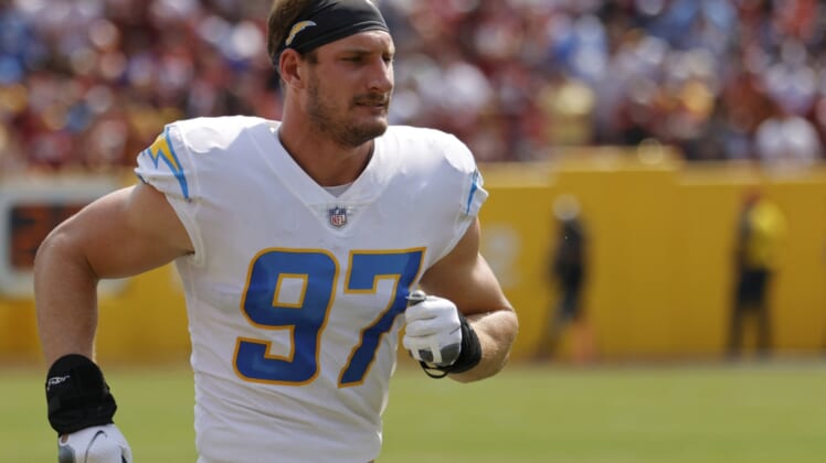 Sep 12, 2021; Landover, Maryland, USA; Los Angeles Chargers linebacker Joey Bosa (97) sprints down the sidelines prior to the Chargers' game against the Washington Football Team at FedExField. Mandatory Credit: Geoff Burke-USA TODAY Sports