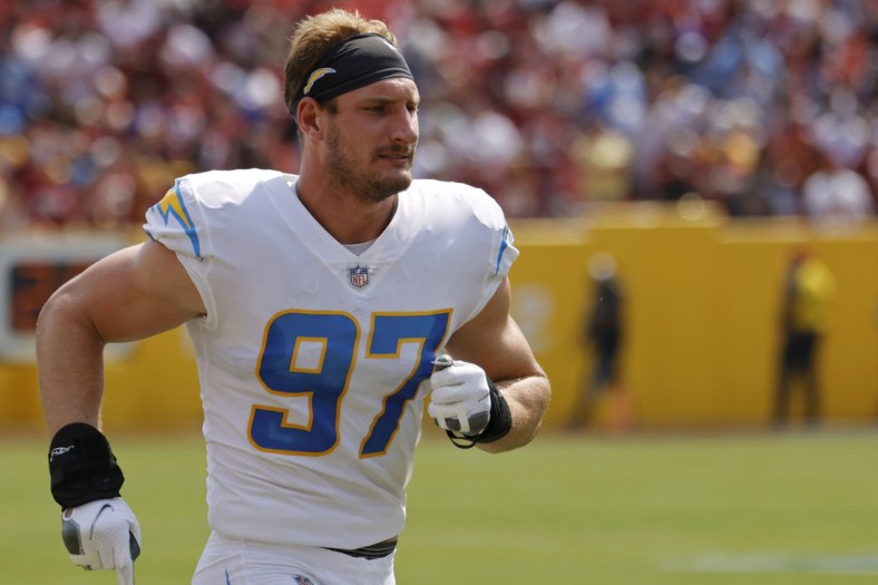 Sep 12, 2021; Landover, Maryland, USA; Los Angeles Chargers linebacker Joey Bosa (97) sprints down the sidelines prior to the Chargers' game against the Washington Football Team at FedExField. Mandatory Credit: Geoff Burke-USA TODAY Sports