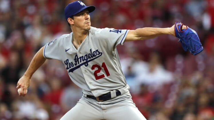 Sep 17, 2021; Cincinnati, Ohio, USA; Los Angeles Dodgers starting pitcher Walker Buehler (21) throws a pitch against the Cincinnati Reds during the first inning at Great American Ball Park. Mandatory Credit: David Kohl-USA TODAY Sports