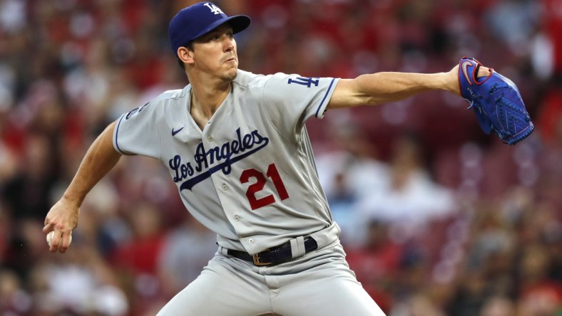 Sep 17, 2021; Cincinnati, Ohio, USA; Los Angeles Dodgers starting pitcher Walker Buehler (21) throws a pitch against the Cincinnati Reds during the first inning at Great American Ball Park. Mandatory Credit: David Kohl-USA TODAY Sports