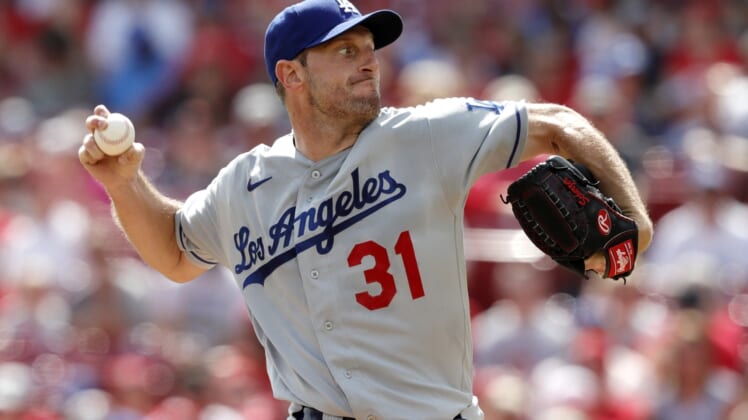 Sep 18, 2021; Cincinnati, Ohio, USA; Los Angeles Dodgers starting pitcher Max Scherzer (31) throws a pitch against the Cincinnati Reds during the first inning at Great American Ball Park. Mandatory Credit: David Kohl-USA TODAY Sports