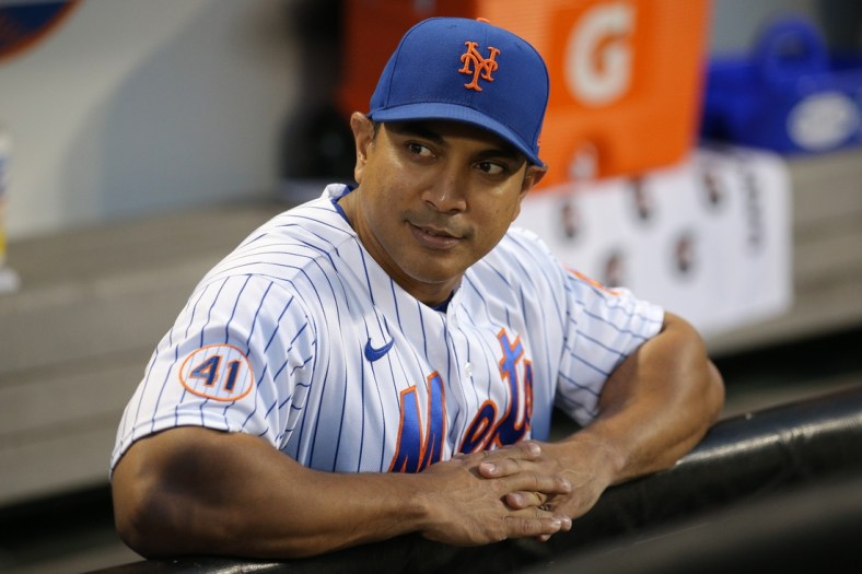 Sep 18, 2021; New York City, New York, USA; New York Mets manager Luis Rojas (19) looks on from the dugout before a game against the Philadelphia Phillies at Citi Field. Mandatory Credit: Brad Penner-USA TODAY Sports