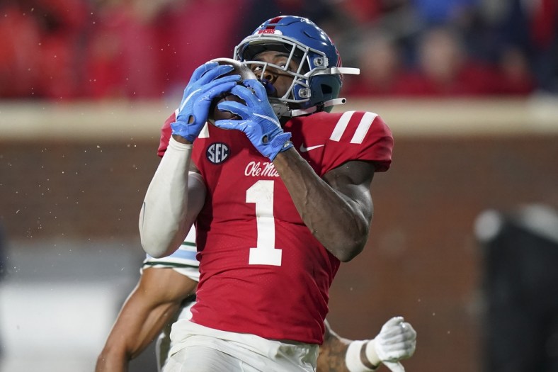 Sep 18, 2021; Oxford, Mississippi, USA; Mississippi Rebels wide receiver Jonathan Mingo (1) catches a touchdown pass against Tulane Green Wave at Vaught-Hemingway Stadium. Mandatory Credit: Marvin Gentry-USA TODAY Sports