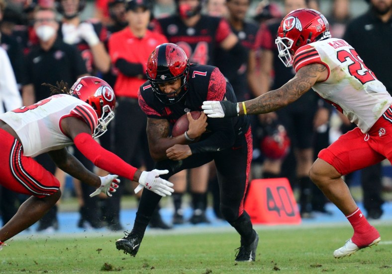Sep 18, 2021; Carson, California, USA; San Diego State Aztecs quarterback Lucas Johnson (7) runs the ball against the Utah Utes during the second half at Dignity Health Sports Park. Mandatory Credit: Gary A. Vasquez-USA TODAY Sports