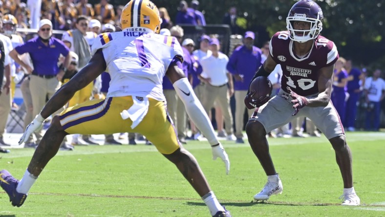 Sep 25, 2021; Starkville, Mississippi, USA; Mississippi State Bulldogs wide receiver Makai Polk (10) runs the ball while defended by LSU Tigers cornerback Eli Ricks (1) during the fourth quarter at Davis Wade Stadium at Scott Field. Mandatory Credit: Matt Bush-USA TODAY Sports