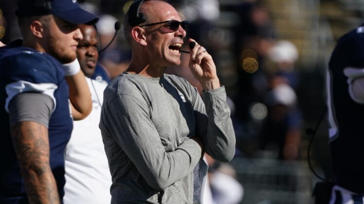 Sep 25, 2021; East Hartford, Connecticut, USA; Connecticut Huskies interim head coach Lou Spanos watches from the sideline against the Wyoming Cowboys during the first quarter at Rentschler Field at Pratt & Whitney Stadium. Mandatory Credit: David Butler II-USA TODAY Sports