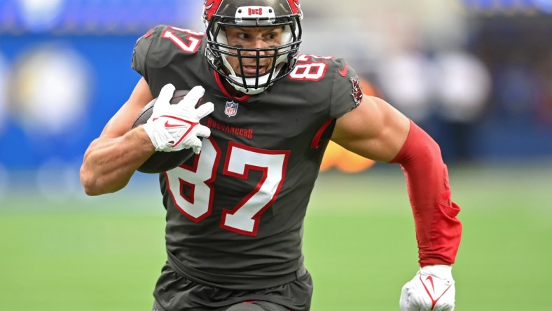 Sep 26, 2021; Inglewood, California, USA;  Tampa Bay Buccaneers tight end Rob Gronkowski (87) completes a pass play and runs for a first down in the first half of the game against the Los Angeles Rams at SoFi Stadium. Mandatory Credit: Jayne Kamin-Oncea-USA TODAY Sports