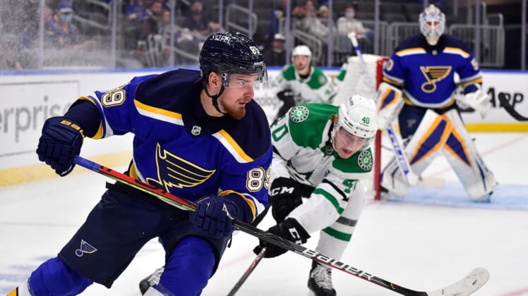 Sep 27, 2021; St. Louis, Missouri, USA;  St. Louis Blues right wing Pavel Buchnevich (89) clears the puck past Dallas Stars center Martin Hanzal (40) during the first period at Enterprise Center. Mandatory Credit: Jeff Curry-USA TODAY Sports