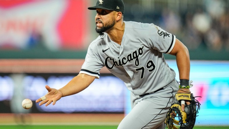 Sep 4, 2021; Kansas City, Missouri, USA; Chicago White Sox first baseman Jose Abreu (79) flips to first base against the Kansas City Royals during the ninth inning at Kauffman Stadium. Mandatory Credit: Jay Biggerstaff-USA TODAY Sports