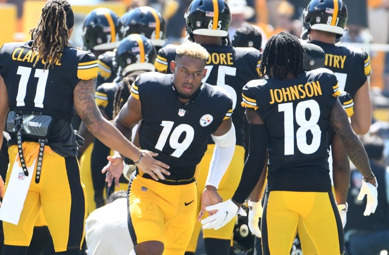 Sep 19, 2021; Pittsburgh, Pennsylvania, USA;  Pittsburgh Steelers wide receiver JuJu Smith-Schuster is greeted by his teammates as they take the field to play the Las Vegas Raiders  at Heinz Field. The Raiders won the game 26-17. Mandatory Credit: Philip G. Pavely-USA TODAY Sports