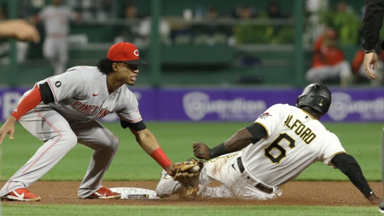 Oct 1, 2021; Pittsburgh, Pennsylvania, USA;  Cincinnati Reds shortstop Jose Barrero (38) tags Pittsburgh Pirates left fielder Anthony Alford (6) out at second base on a steal attempt during the fourth inning at PNC Park. Mandatory Credit: Charles LeClaire-USA TODAY Sports