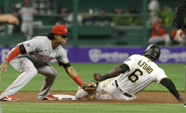 Oct 1, 2021; Pittsburgh, Pennsylvania, USA;  Cincinnati Reds shortstop Jose Barrero (38) tags Pittsburgh Pirates left fielder Anthony Alford (6) out at second base on a steal attempt during the fourth inning at PNC Park. Mandatory Credit: Charles LeClaire-USA TODAY Sports