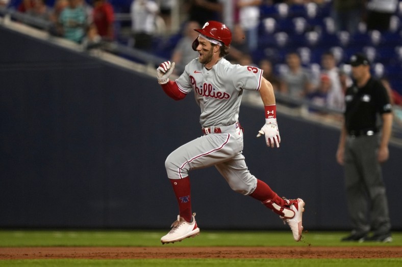Oct 1, 2021; Miami, Florida, USA; Philadelphia Phillies right fielder Bryce Harper (3) runs to second base for a RBI double against the Miami Marlins in the 3rd inning at loanDepot park. Mandatory Credit: Jasen Vinlove-USA TODAY Sports