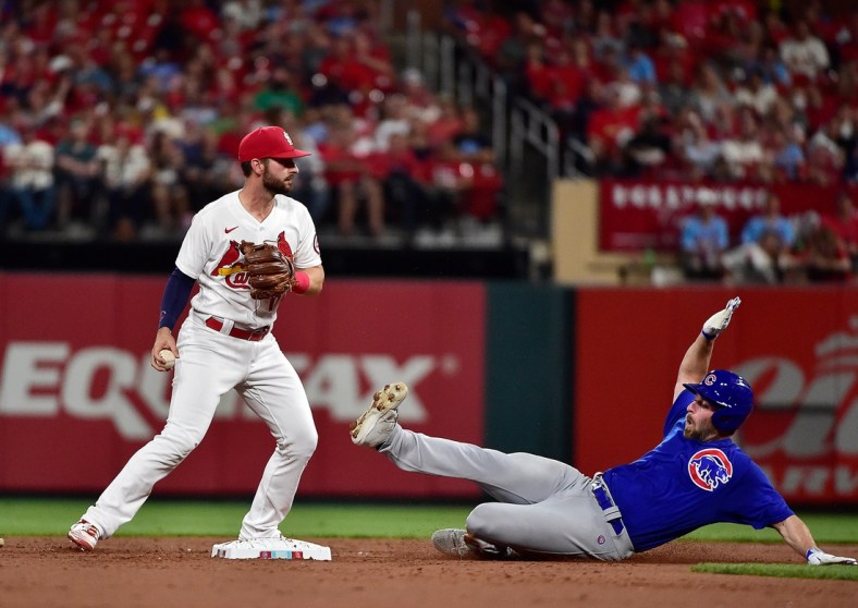 Oct 1, 2021; St. Louis, Missouri, USA;  Chicago Cubs starting pitcher Cory Abbott (15) slides in at after he was forced out by St. Louis Cardinals shortstop Paul DeJong (11) during the third inning at Busch Stadium. Mandatory Credit: Jeff Curry-USA TODAY Sports