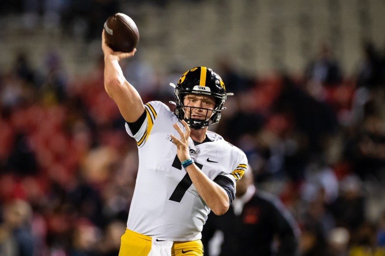 Oct 1, 2021; College Park, Maryland, USA; Iowa Hawkeyes quarterback Spencer Petras (7) warms up before the game against the Maryland Terrapins at Capital One Field at Maryland Stadium. Mandatory Credit: Scott Taetsch-USA TODAY Sports