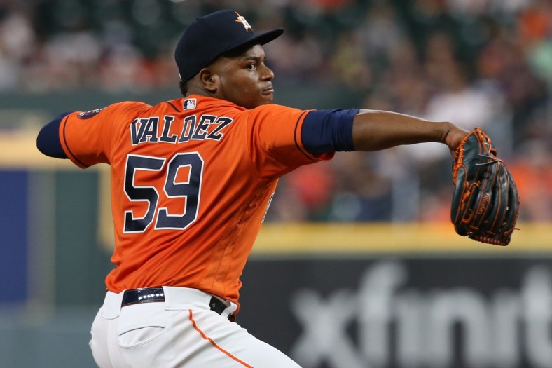 Oct 1, 2021; Houston, Texas, USA; Houston Astros starting pitcher Framber Valdez (59) pitches against the Oakland Athletics in the third inning at Minute Maid Park. Mandatory Credit: Thomas Shea-USA TODAY Sports