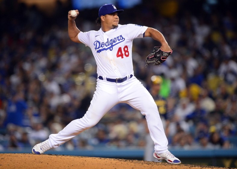 Oct 1, 2021; Los Angeles, California, USA; Los Angeles Dodgers relief pitcher Brusdar Graterol (48) throws against the Milwaukee Brewers during the third inning at Dodger Stadium. Mandatory Credit: Gary A. Vasquez-USA TODAY Sports