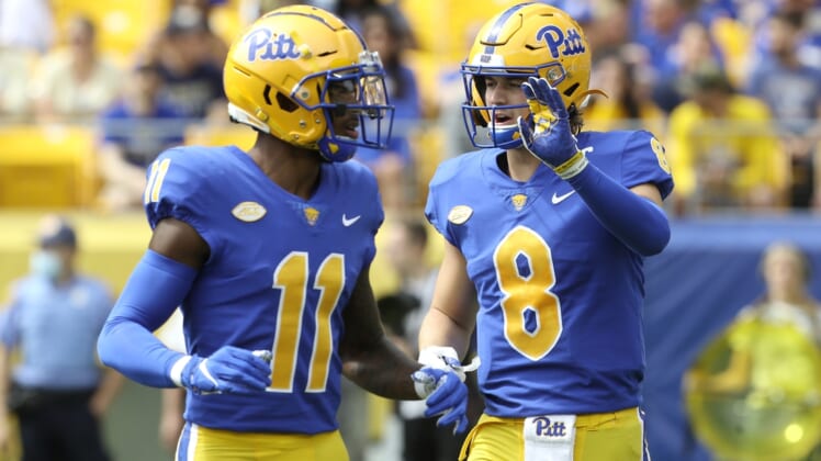 Sep 25, 2021; Pittsburgh, Pennsylvania, USA;  Pittsburgh Panthers wide receiver Taysir Mack (11) and quarterback Kenny Pickett (8) talk before a play against the New Hampshire Wildcats during the second quarter at Heinz Field. Mandatory Credit: Charles LeClaire-USA TODAY Sports