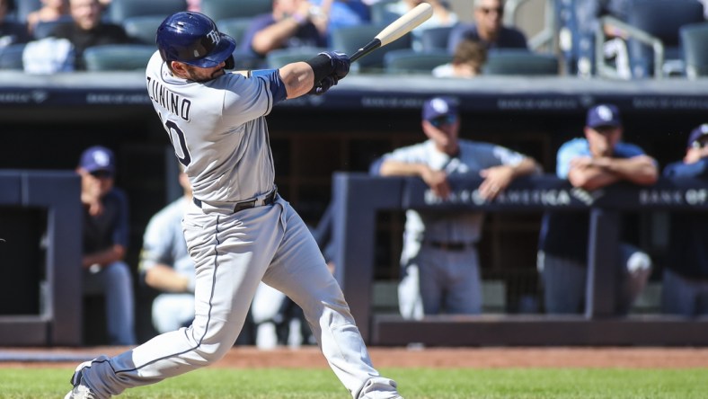 Oct 2, 2021; Bronx, New York, USA; Tampa Bay Rays catcher Mike Zunino (10) hits a solo home run in the third inning against the New York Yankees at Yankee Stadium. Mandatory Credit: Wendell Cruz-USA TODAY Sports