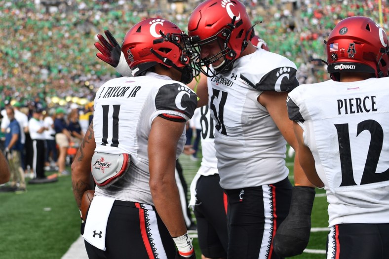 Oct 2, 2021; South Bend, Indiana, USA; Cincinnati Bearcats tight end Leonard Taylor (11) celebrates after a touchdown in the second quarter against the Notre Dame Fighting Irish at Notre Dame Stadium. Mandatory Credit: Matt Cashore-USA TODAY Sports