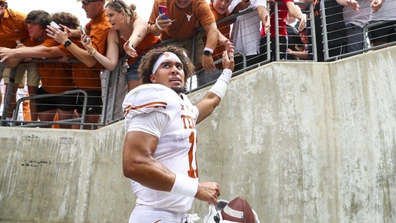 Oct 2, 2021; Fort Worth, Texas, USA; Texas Longhorns quarterback Casey Thompson (11) shakes hands with fans after the game against the TCU Horned Frogs at Amon G. Carter Stadium. Mandatory Credit: Kevin Jairaj-USA TODAY Sports