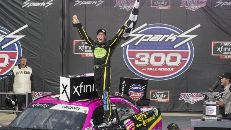 Oct 2, 2021; Talladega, AL, USA; NASCAR Xfinity Series driver Brandon Brown celebrates after he won the darkness shortened race at Talladega Speedway. Mandatory Credit: Marvin Gentry-USA TODAY Sports