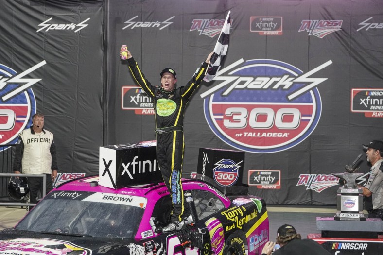 Oct 2, 2021; Talladega, AL, USA; NASCAR Xfinity Series driver Brandon Brown celebrates after he won the darkness shortened race at Talladega Speedway. Mandatory Credit: Marvin Gentry-USA TODAY Sports