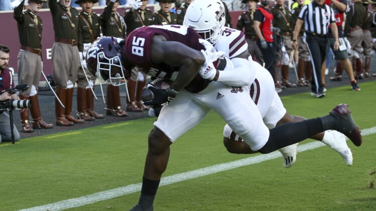 Oct 2, 2021; College Station, Texas, USA; Texas A&M Aggies tight end Jalen Wydermyer (85) catches a touchdown pass against Mississippi State Bulldogs safety Fred Peters (38)  in the first quarter at Kyle Field. Mandatory Credit: Thomas Shea-USA TODAY Sports