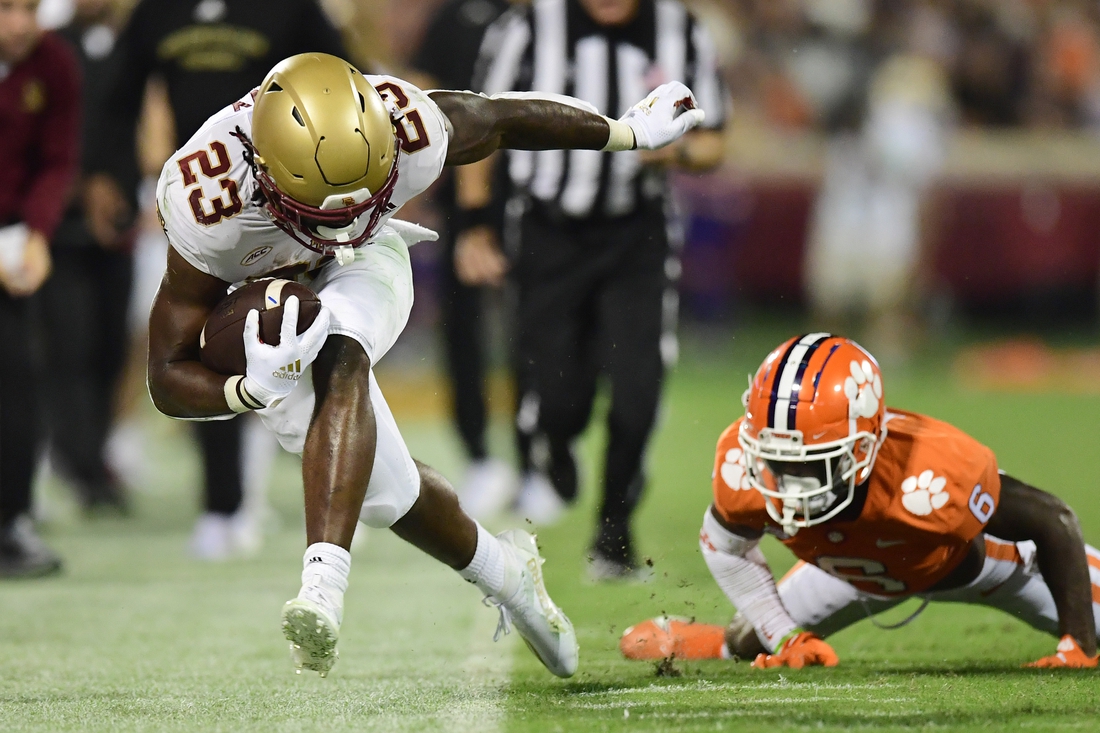 Oct 2, 2021; Clemson, South Carolina, USA; Boston College Eagles running back Travis Levy (23) is pushed out of bounds by Clemson Tigers cornerback Sheridan Jones (6) during the second quarter at Memorial Stadium. Mandatory Credit: Adam Hagy-USA TODAY Sports