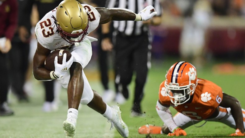 Oct 2, 2021; Clemson, South Carolina, USA; Boston College Eagles running back Travis Levy (23) is pushed out of bounds by Clemson Tigers cornerback Sheridan Jones (6) during the second quarter at Memorial Stadium. Mandatory Credit: Adam Hagy-USA TODAY Sports