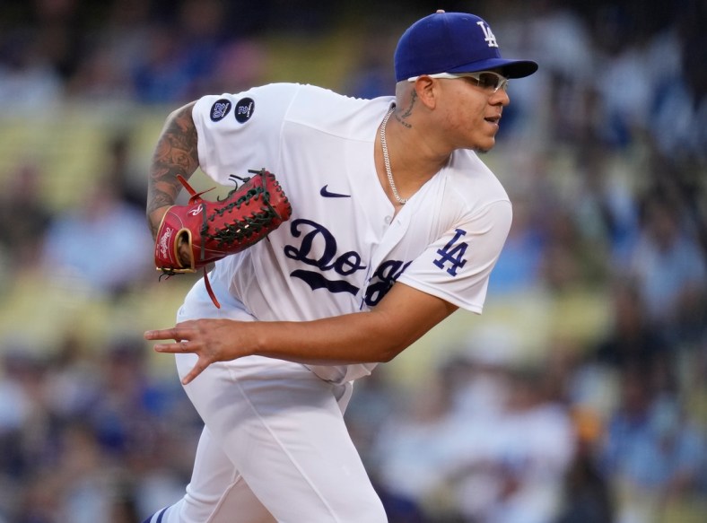 Oct 2, 2021; Los Angeles, California, USA; Los Angeles Dodgers starting pitcher Julio Urias (7) follows through on a pitch against the Milwaukee Brewers in the first inning at Dodger Stadium. Mandatory Credit: Robert Hanashiro-USA TODAY Sports