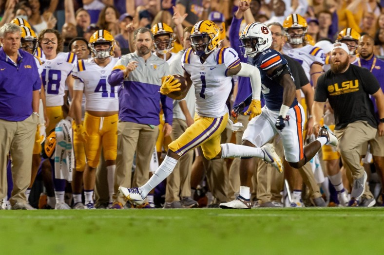 Kayshon Boutte (5) gained 55 yards on LSU's first play and capped the drive with a 31-yard touchdown reception.

Syndication The Daily Advertiser