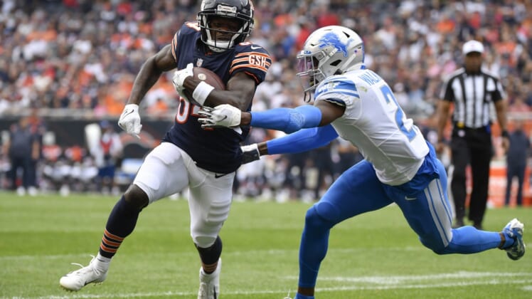 Oct 3, 2021; Chicago, Illinois, USA; Chicago Bears wide receiver Marquise Goodwin (84) runs with the football in the first half against Detroit Lions free safety Tracy Walker III (21) at Soldier Field. Mandatory Credit: Quinn Harris-USA TODAY Sports