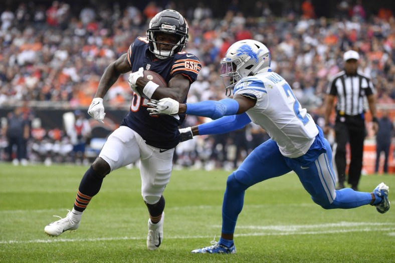 Oct 3, 2021; Chicago, Illinois, USA; Chicago Bears wide receiver Marquise Goodwin (84) runs with the football in the first half against Detroit Lions free safety Tracy Walker III (21) at Soldier Field. Mandatory Credit: Quinn Harris-USA TODAY Sports